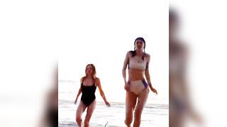 : Alexandra Daddario and Sydney Sweeney running on the beach together #2