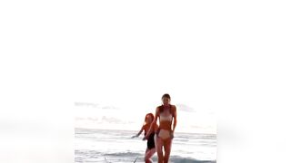 : Alexandra Daddario and Sydney Sweeney running on the beach together #3