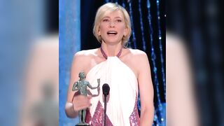 Cate Blanchett stroking her award