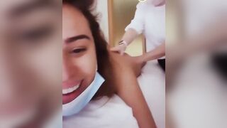 Yanet Garcia getting a massage