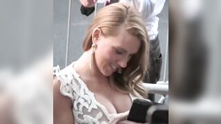 Scarlett Johansson's tits almost pulling out of her dress