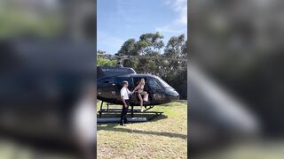 Kiernan Shipka, coming out of a helicopter in a bikinee